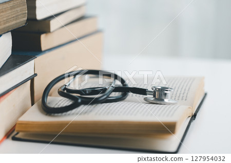 Concept business education essential idea globalization, student learn and study in university and colleges to master knowledge needed travel global economy. book stethoscope for medical health care Concept business education essential idea globalization, student learn and study in university and colleges to master knowledge needed travel global economy. book stethoscope for medical health care 127954032