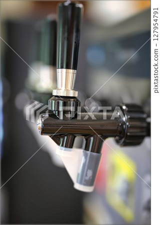 Close-up of a beer dispenser Close-up of a beer dispenser 127954791