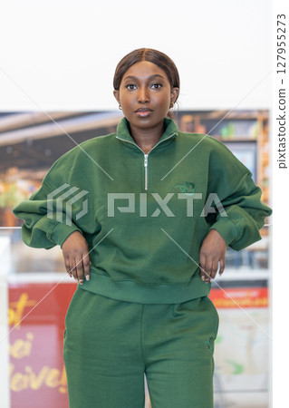A Stylish and Fashionable Woman Wearing a Chic Green Athleisure Outfit that Exudes Confidence A Stylish and Fashionable Woman Wearing a Chic Green Athleisure Outfit that Exudes Confidence 127955273