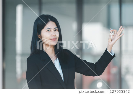 Woman hand hold key buy home model business concept involves sell financial management investment bank loan ownership income economy finance investments purchasing apartment blur background estate Woman hand hold key buy home model business concept involves sell financial management investment bank loan ownership income economy finance investments purchasing apartment blur background estate 127955542