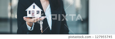 Woman hand hold key buy home model business concept involves sell financial management investment bank loan ownership income economy finance investments purchasing apartment blur background estate Woman hand hold key buy home model business concept involves sell financial management investment bank loan ownership income economy finance investments purchasing apartment blur background estate 127955745