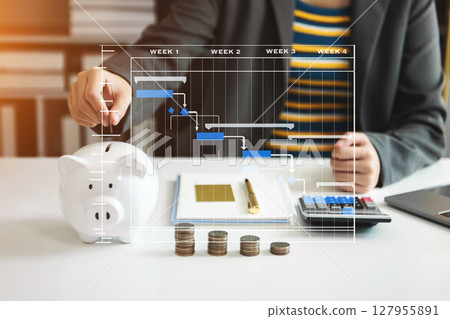 Business woman hand putting money coin into piggy bank with step of growing stack coins for saving money with virtual icon Business woman hand putting money coin into piggy bank with step of growing stack coins for saving money with virtual icon 127955891