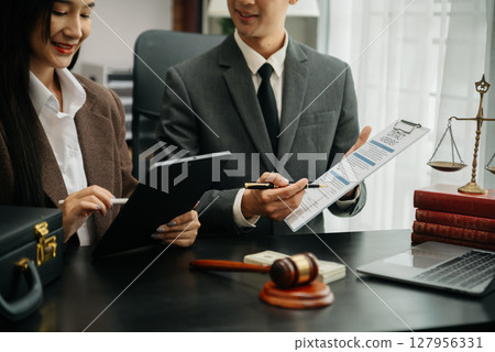 Business and Male lawyer or judge consult having team meeting with client, Law and Legal services concept.Customer service good cooperation in office Business and Male lawyer or judge consult having team meeting with client, Law and Legal services concept.Customer service good cooperation in office 127956331