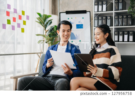 Portrait of success business people working together in home office. Couple teamwork startup concept 127956758