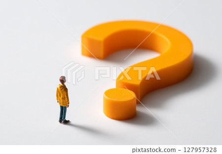 Illustration of a miniature person looking up at a question mark 127957328