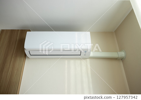 Air conditioner in room for cool climate. 127957342