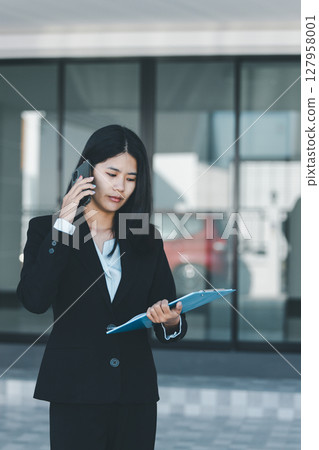 Woman hand hold key buy home model business concept involves sell financial management investment bank loan ownership income economy finance investments purchasing apartment blur background estate 127958001