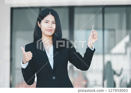 Woman hand hold key buy home model business concept involves sell financial management investment bank loan ownership income economy finance investments purchasing apartment blur background estate Woman hand hold key buy home model business concept involves sell financial management investment bank loan ownership income economy finance investments purchasing apartment blur background estate 127958003