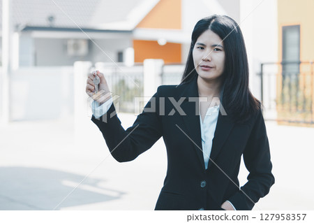 Woman hand hold key buy home model business concept involves sell financial management investment bank loan ownership income economy finance investments purchasing apartment blur background estate Woman hand hold key buy home model business concept involves sell financial management investment bank loan ownership income economy finance investments purchasing apartment blur background estate 127958357