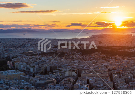 A breathtaking view of the sunset over the city of Athens, Greece from the top of the Lycabettus hill A breathtaking view of the sunset over the city of Athens, Greece from the top of the Lycabettus hill 127958505