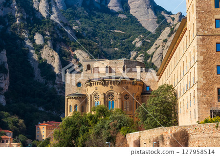 Famous Santa Maria de Montserrat Abbey located on the mountain of Montserrat nearby from Barcelona in Catalonia, Spain. Montserrat Monastery 127958514