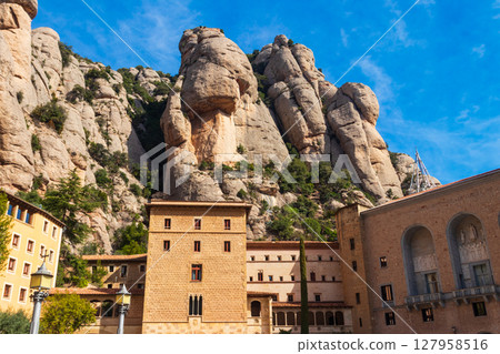Famous Santa Maria de Montserrat Abbey located on the mountain of Montserrat nearby from Barcelona in Catalonia, Spain. Montserrat Monastery Famous Santa Maria de Montserrat Abbey located on the mountain of Montserrat nearby from Barcelona in Catalonia, Spain. Montserrat Monastery 127958516