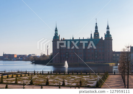 Frederiksborg castle with picturesque baroque castle garden in Hillerod, Denmark Frederiksborg castle with picturesque baroque castle garden in Hillerod, Denmark 127959111