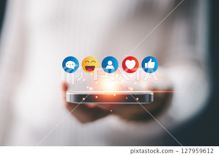 Concept of social business technology ai digital creation features website sticker, heart and like buttons, phone emojis, People express feel icon. contact hand on laptop and mobile device on desk. Concept of social business technology ai digital creation features website sticker, heart and like buttons, phone emojis, People express feel icon. contact hand on laptop and mobile device on desk. 127959612