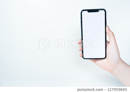contactless in new normal concept from woman hand hold and smart phone with white isolated background contactless in new normal concept from woman hand hold and smart phone with white isolated background 127959693