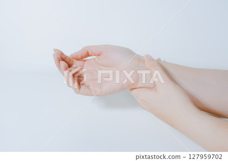 massage hand and finger after pain and ache in office working with white isolated background massage hand and finger after pain and ache in office working with white isolated background 127959702