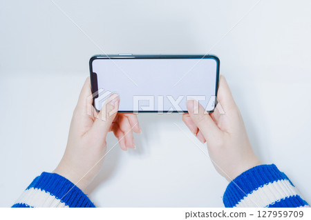 contactless in new normal concept from woman hand hold and smart phone with white isolated background 127959709