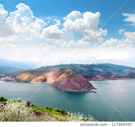 Aerial view of the Charvak reservoir, Tashkent region, Uzbekistan, Central asia. Top view on lake Charvak is a water reservoir in Bostanliq District, Czatkalski Rezerwat Biosfery 127960495