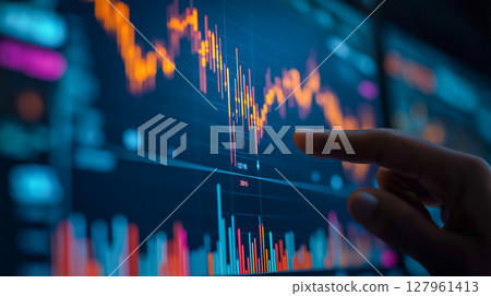Investor reviews financial chart on the screen 127961413