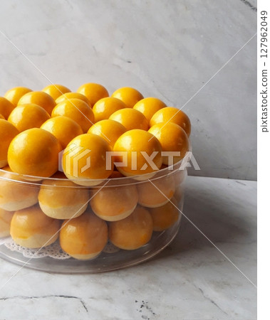 Pineapple cake, called Kue Nenas or Nastar in Indonesian, is one of the most popular traditional sweets to celebrate Eid al-Fitr. Indonesian people's favorite sweets. Selective focus. Pineapple cake, called Kue Nenas or Nastar in Indonesian, is one of the most popular traditional sweets to celebrate Eid al-Fitr. Indonesian people's favorite sweets. Selective focus. 127962049