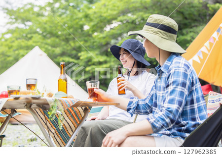 Friends who enjoy camping 127962385