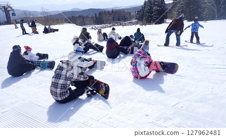 Snowboarders 127962481