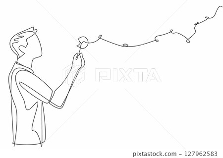 Single one line drawing man in casual clothes blows on dandelion and there are dandelion fragments flying. Blow the hopes sky high. Symbol. World Wish Day. Continuous line design graphic illustration 127962583