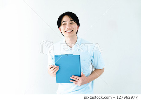 A man working as a caregiver holding a file 127962977