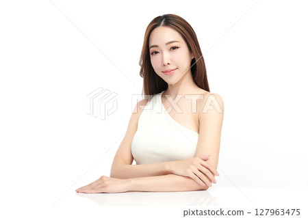A beautiful young Asian woman with clean, fresh skin against a white background. Skincare, facial treatment, cosmetology, beauty, and spa. An elegant portrait of an Asian woman. A beautiful young Asian woman with clean, fresh skin against a white background. Skincare, facial treatment, cosmetology, beauty, and spa. An elegant portrait of an Asian woman. 127963475