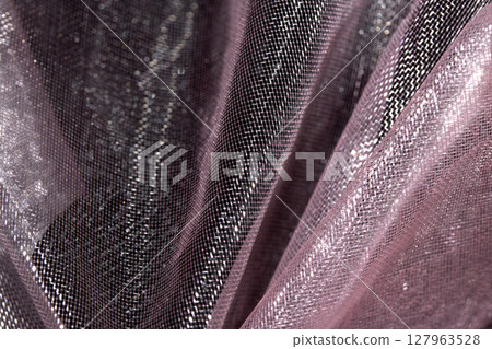 Close up of pink organza silk fabric in delicate waves for background 127963528