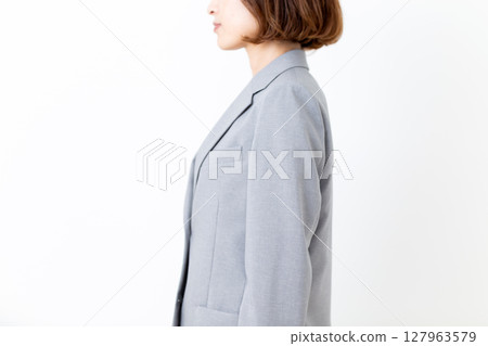 Posture of a middle-aged woman in a suit 127963579