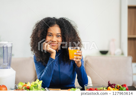Fit woman enjoys healthy fruit breakfast after yoga training. fitness, nutrition, home lifestyle. 127963614