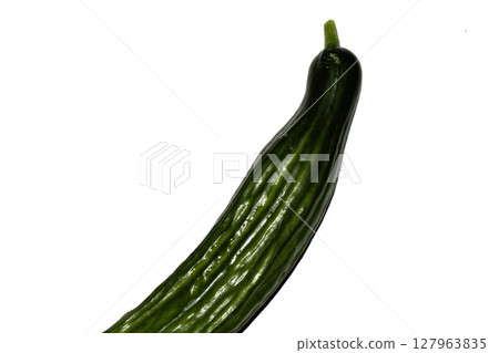 Close up of home grown cucumber vegetable skin green on white background Close up of home grown cucumber vegetable skin green on white background 127963835