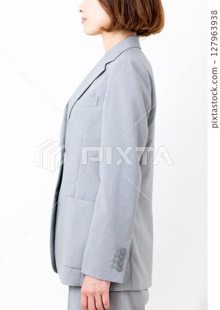 Posture of a middle-aged woman in a suit 127963938