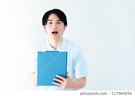 A man working as a caregiver holding a file 127964056
