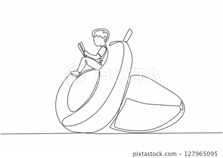 Continuous one line drawing boy reading reading on a cut avocado. Sit back, read seriously. Learn anywhere. Boy Reading Book at Vegetables and Fruits. Single line draw design vector illustration 127965095