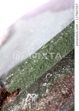 Close up of spiritual holistic crystal grain and rock for background 127965567