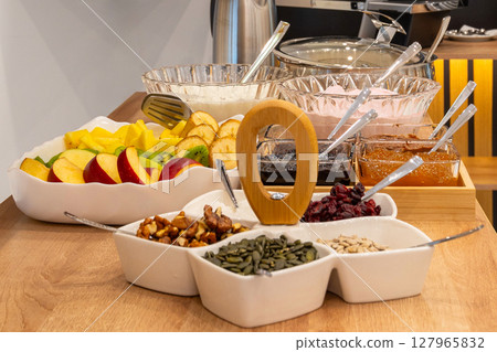 assorted dried fruits, nuts and seeds, hotel buffet breakfast assorted dried fruits, nuts and seeds, hotel buffet breakfast 127965832