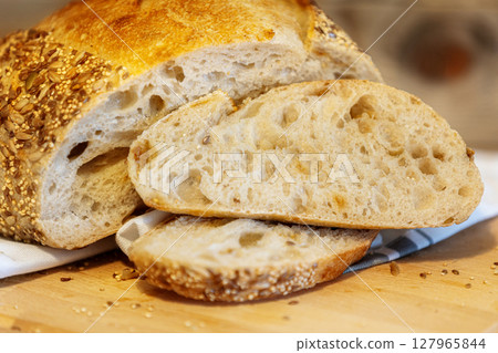 Homemade bread, sourdough wheat loaf with seeds 127965844