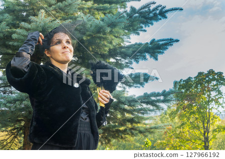 A Outdoors portrait of a victorian lady in black A Outdoors portrait of a victorian lady in black 127966192
