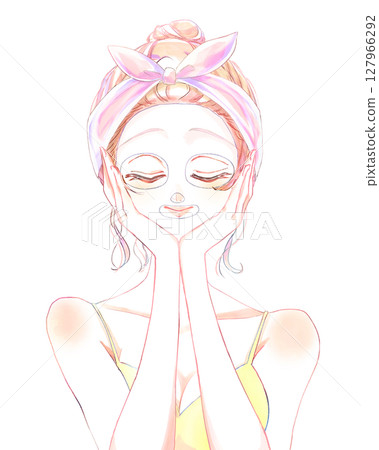 Woman applying face mask, bun hairstyle 127966292