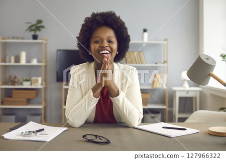 African american business woman talking and giving online advice to her client using laptop webcam. 127966322
