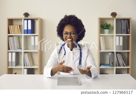 Head shot portrait of african american female doctor talking to camera 127966517