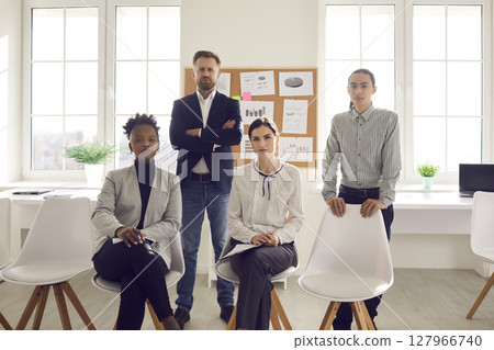 Portrait of young confident diverse colleagues or company managers looking at camera. 127966740