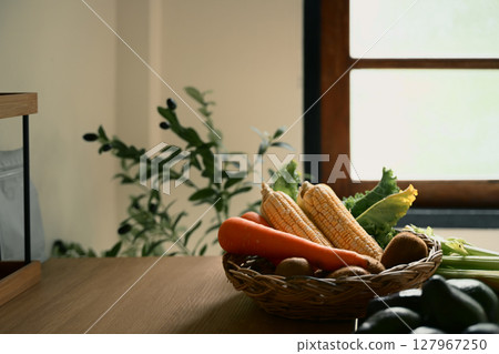 Rustic basket filled with fresh vegetables, ready for cooking or healthy meal prep 127967250
