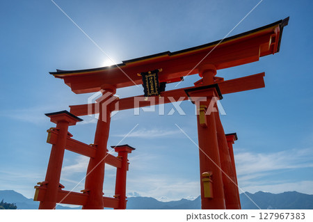 Close-up view of the famous Itsukushima shrine red torii gate in Miyajima, Japan Close-up view of the famous Itsukushima shrine red torii gate in Miyajima, Japan 127967383