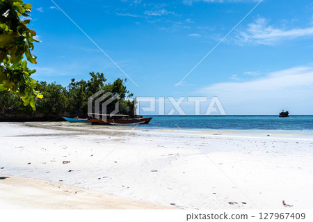 Traditional boat on Lia beach, Waleakodi Island, Togian archipelago, Sulawesi, Indonesia 127967409