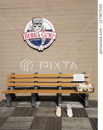 A bench in front of the Bubba Gump restaurant is San Francisco in USA 127967988