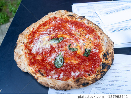 Fresh pizza with tomato, cheese, and basil 127968341