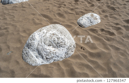 Layered rocks, flysch texture background. Sedimentary rock, striations stone pattern 127968347